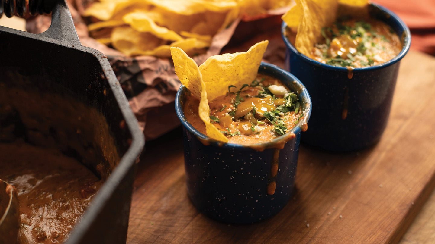 Campfire Queso bubbling in cast iron