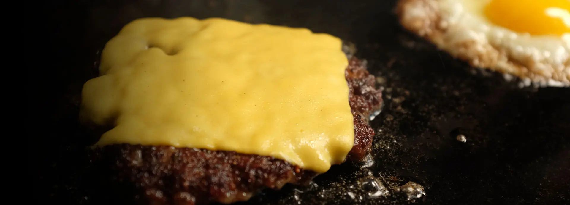 BBQ Griddle with cooking burger